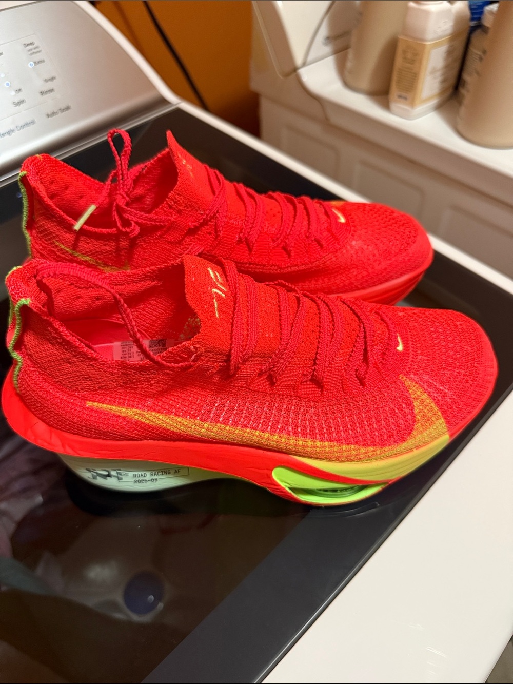 Nike women’s Red Knit High-Top Running Sneakers with Neon Accents